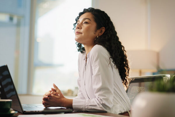 Business woman looking up and thinking