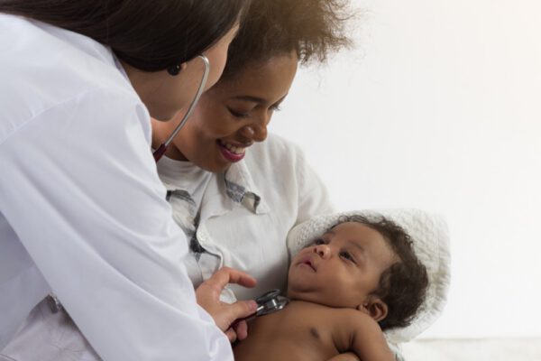 Doctor treating infant patient